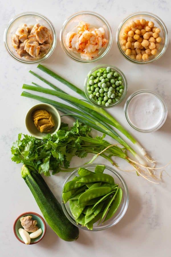 All ingredients for Thai Green Curry laid out on a kitchen counter.
