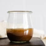 Maple Mustard Balsamic Dressing in a glass jar.