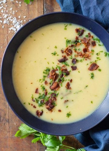 Potato Leek Soup in blue bowl with crispy bacon