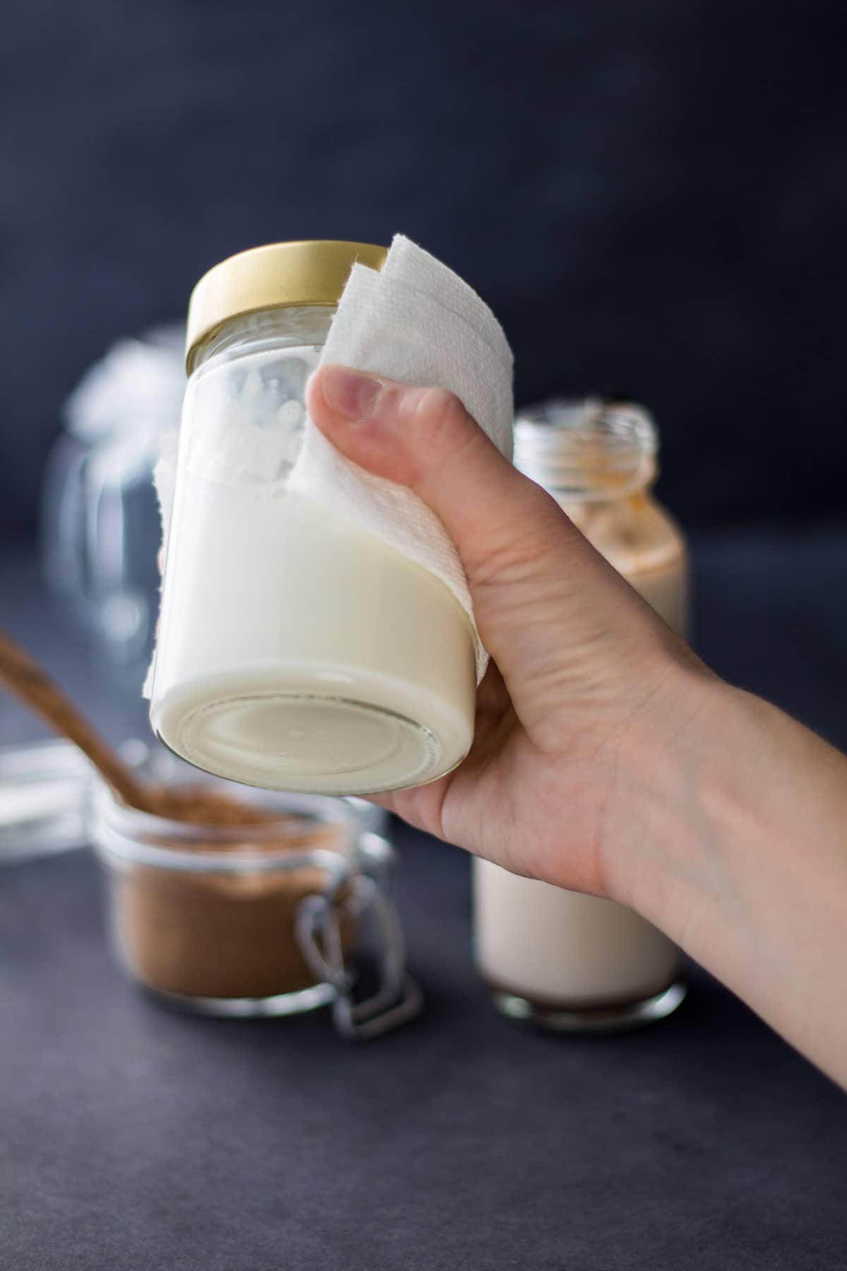 Frothing hot milk in a jar to make homemade chai latte.
