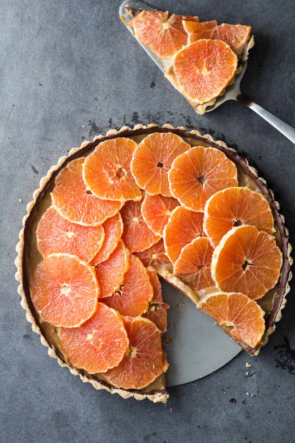 Piece cut out of chocolate orange tart