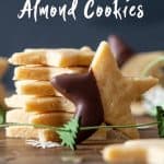 One Almond Flour Cookie leaning agains a stack of Almond Cookies