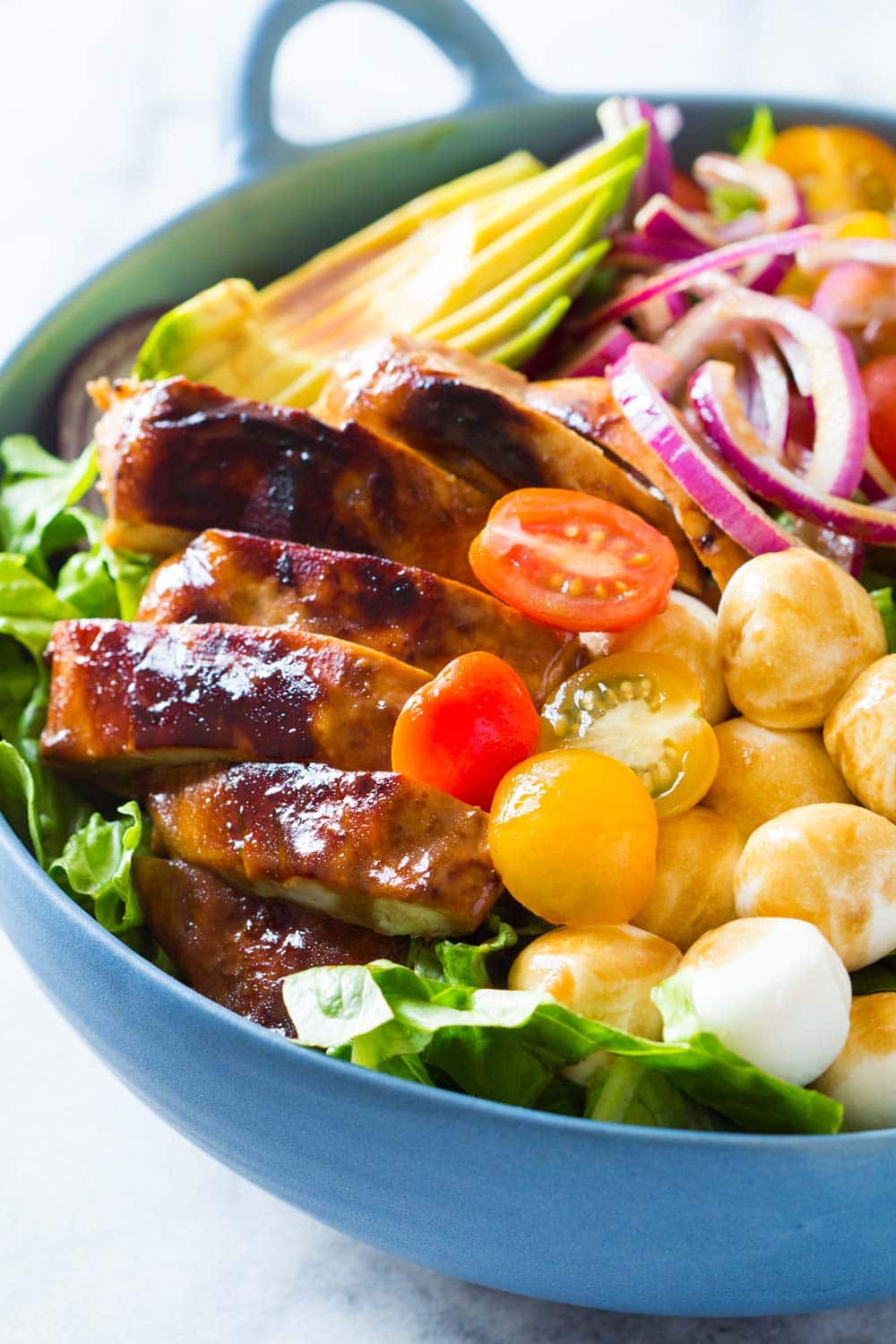 Honey mustard chicken salad served in a blue bowl. 