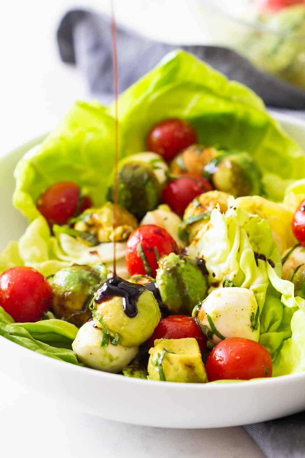 Avocado Tomato Salad with Balsamic Reduction drizzled on top