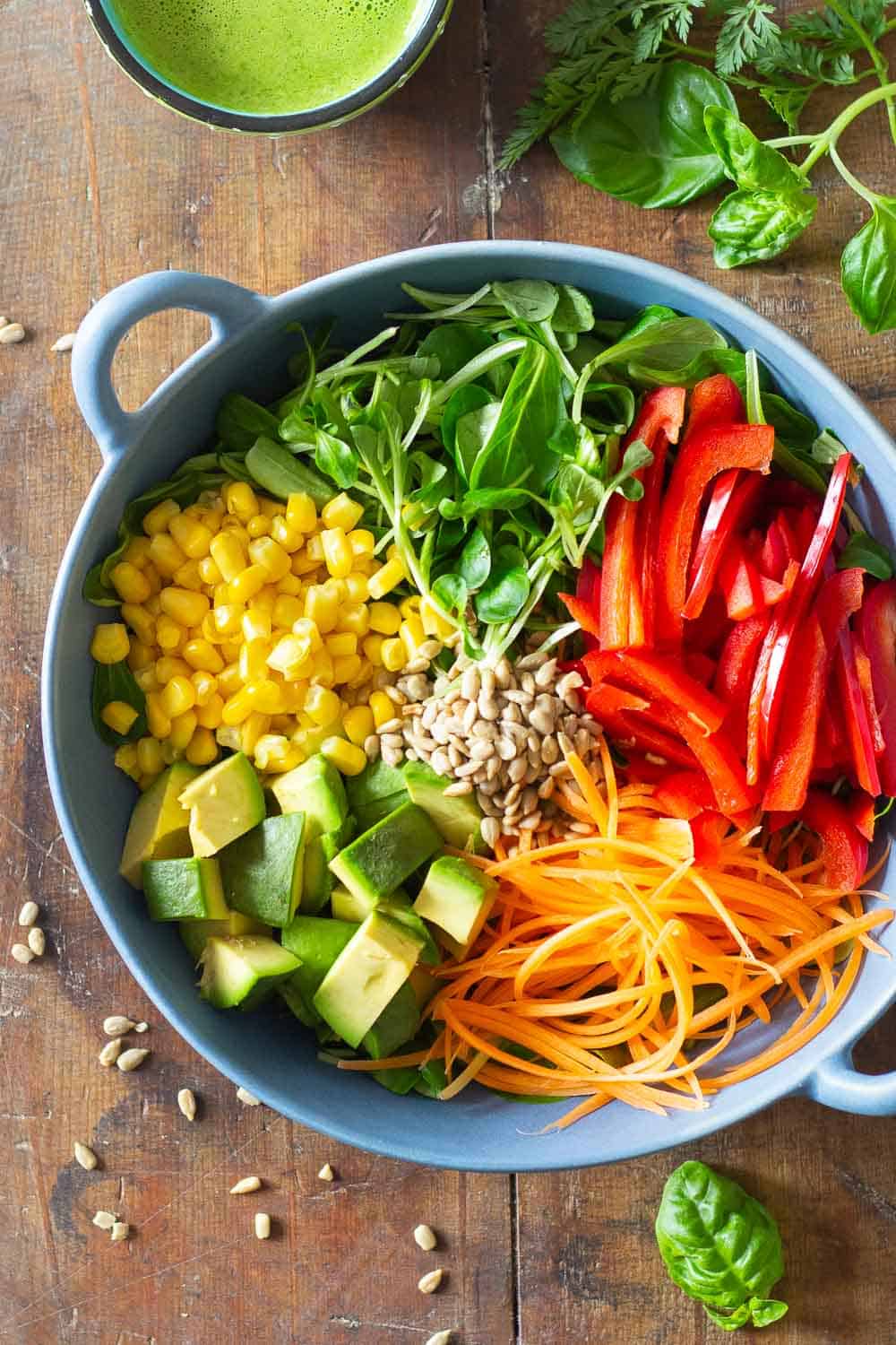 Summer Salad Ingredients in a blue salad bowl.