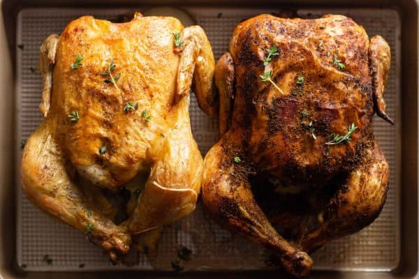 Two Whole Roasted Chickens in a roasting pan