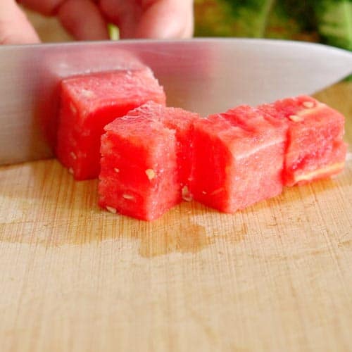 cutting watermelon into cubes