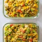Two Chicken Quinoa Meal Prep Bowls on a kitchen counter.