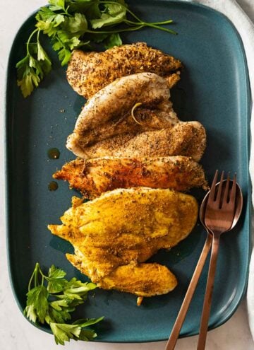 Finished Baked Chicken Breast on a teal-colored platter.