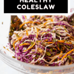 Healthy Coleslaw in a large glass salad bowl with text overlay for Pinterest.
