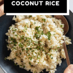 Coconut Rice in a blue bowl held in hands with text overlay for Pinterest.