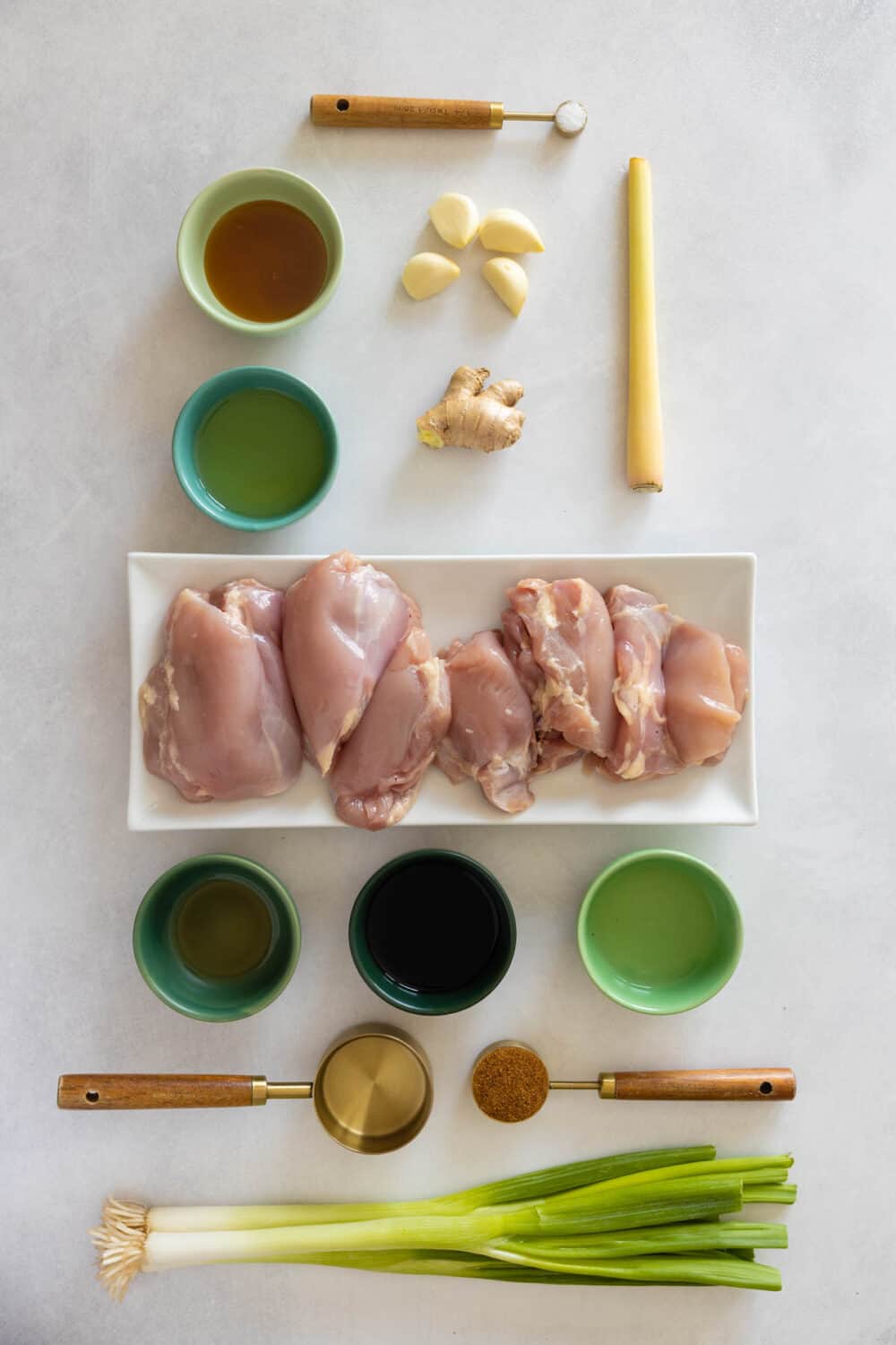 Ingredients for Lemongrass Ginger Chicken recipe all laid out on a kitchen counter.