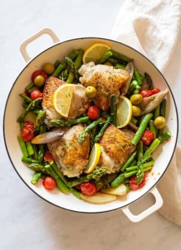 Finished Mediterranean Chicken Dinner in a white pan.