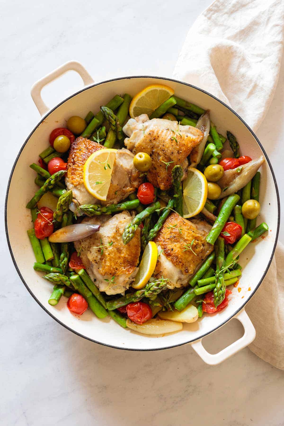 Finished Mediterranean Chicken Dinner in a white pan.