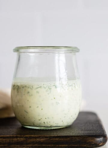Greek Yogurt Herb Dressing in a glass jar.