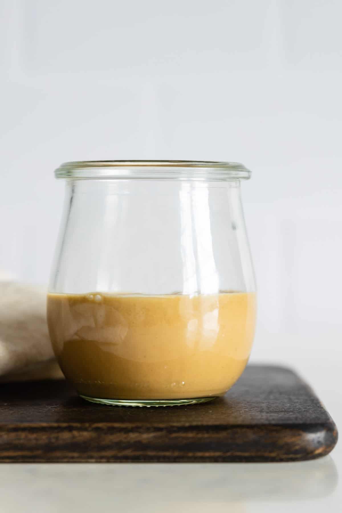 Peanut Salad Dressing in a glass jar.