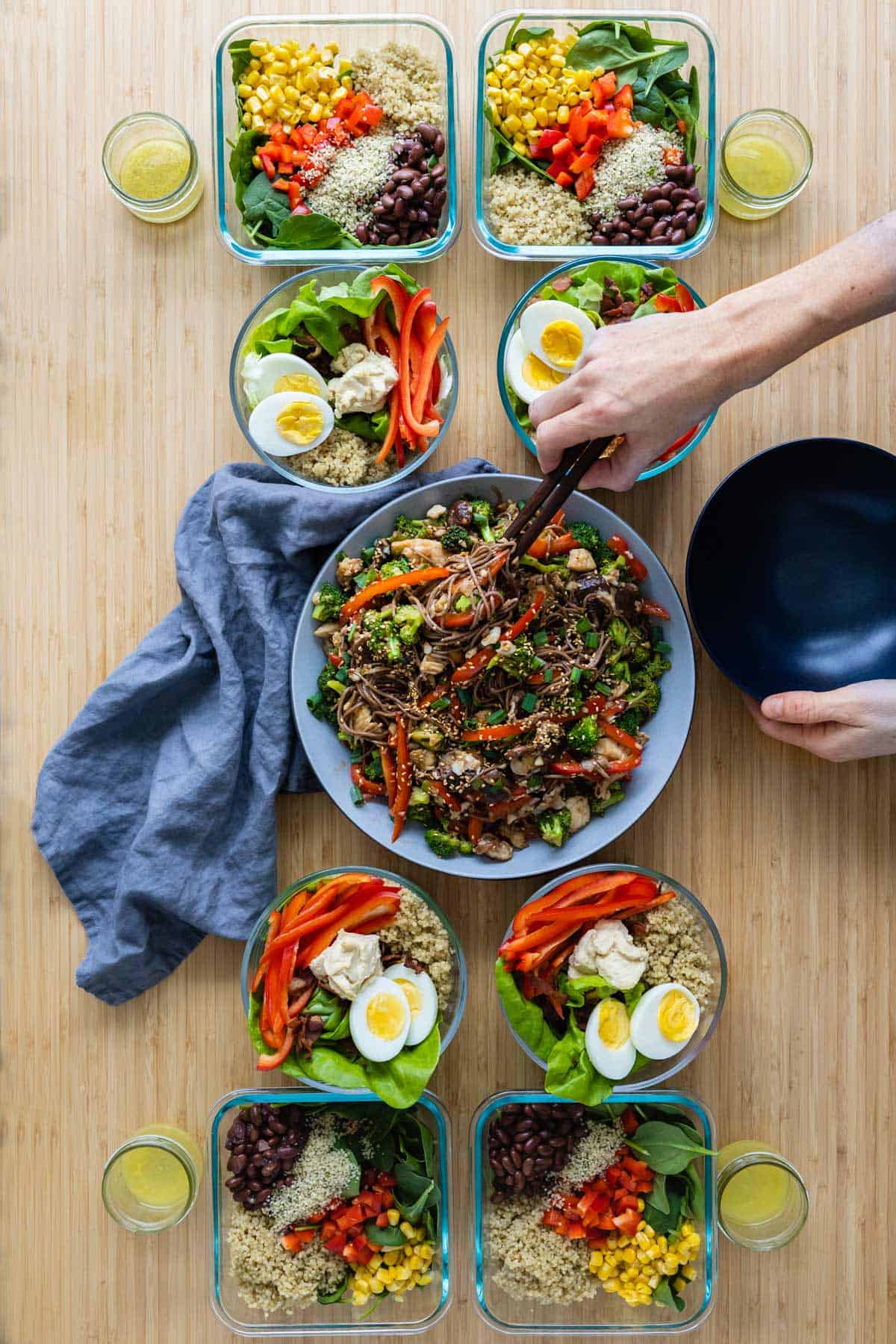 3 different Meal Prep Recipes lined up on a kitchen table.