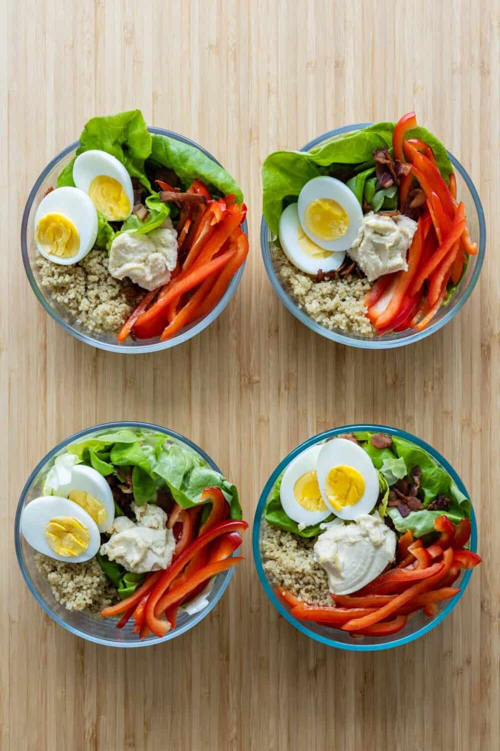 Quinoa Egg Meal Prep Bowls lined up.