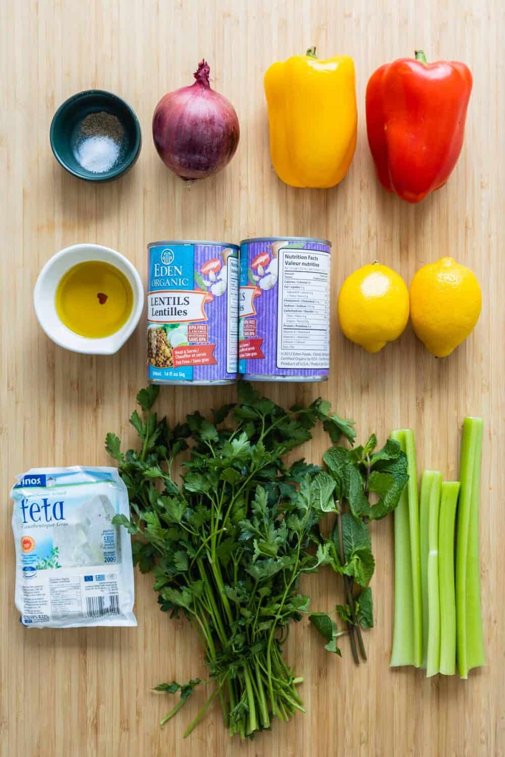 Ingredients for lentil salad laid out on a kitchen counter.