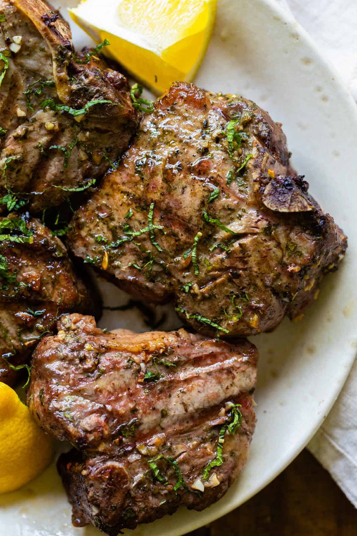 Grilled lamb chops on a plate.
