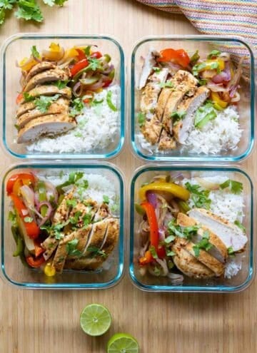 Four meal prep bowls filled with chicken fajitas and rice.