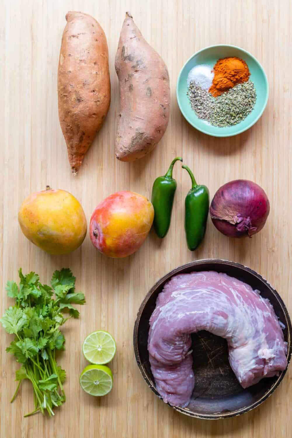 Ingredients for Pork Mango Meal Prep Bowls laid out on a kitchen counter.