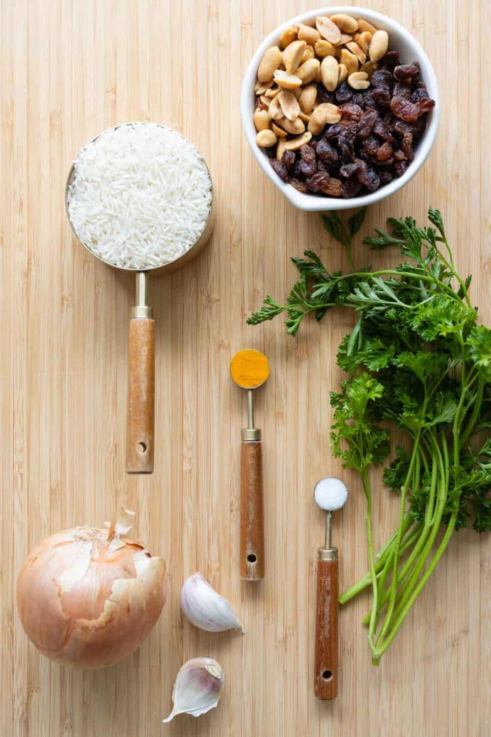 Ingredients for gourmet yellow rice laid out on a kitchen counter.