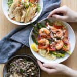 Three serving bowls filled each with a different 30-minute dinner recipe.
